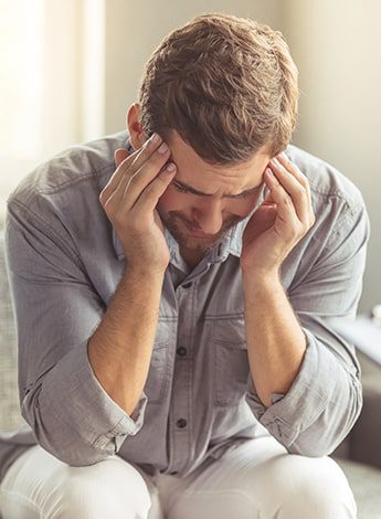 Man Holding His Head